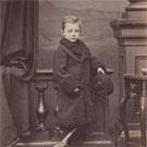 Unidentified boy in fur-lined coat